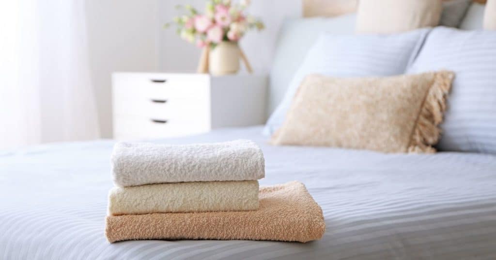 Wash bedding and towels frequently