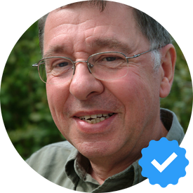 A middle-aged man with glasses, smiling outdoors, verified review icon, identified as Robert L., a satisfied Hellamaid customer.