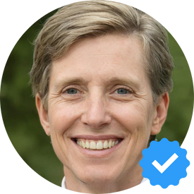  close-up portrait of Margaret Collins, a 50-year-old woman with short light brown hair, smiling warmly. She is sharing her positive experience with Hellamaid cleaning services in North Vancouver. The background features lush greenery.