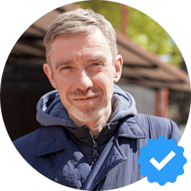 Mark Davis from Richmond, a middle-aged man in a blue jacket, smiling with a verified checkmark, showcasing his positive experience with Hellamaid's cleaning services.