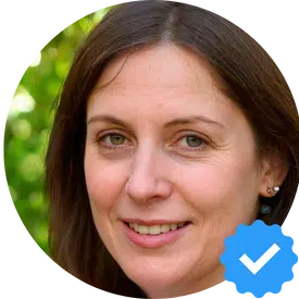 Portrait of a woman with a blue verification checkmark badge in New Westminster.