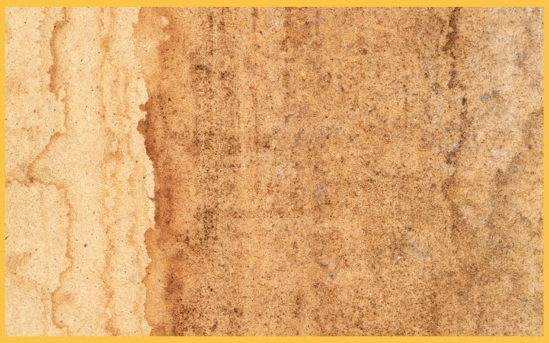 Close-up of textured wood grain in warm tones, featuring light and dark shades of brown with subtle variations and natural patterns.