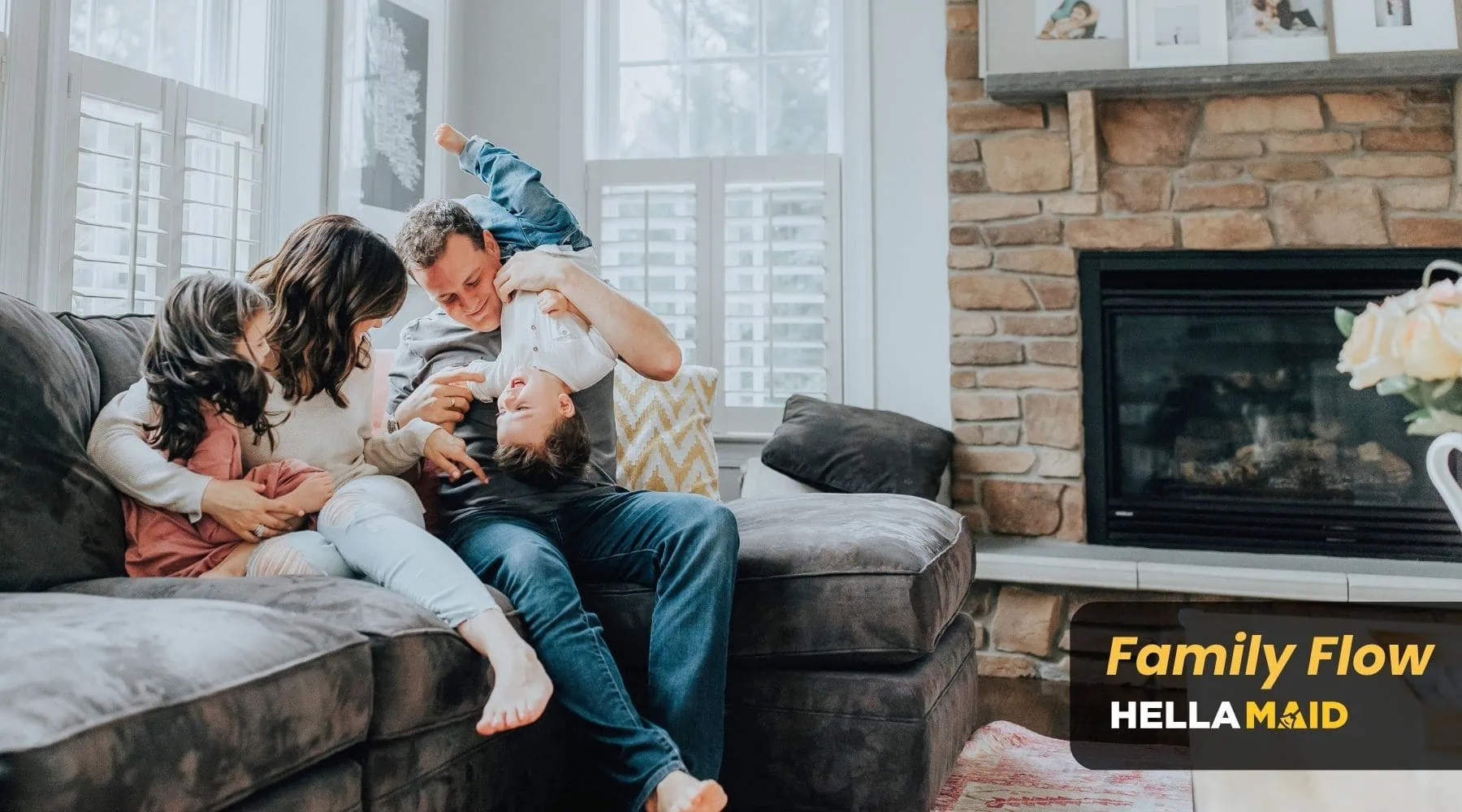 Happy family enjoying quality time in a clean living room, with comfortable seating and a cozy atmosphere, ideal for The Family Flow cleaning package.