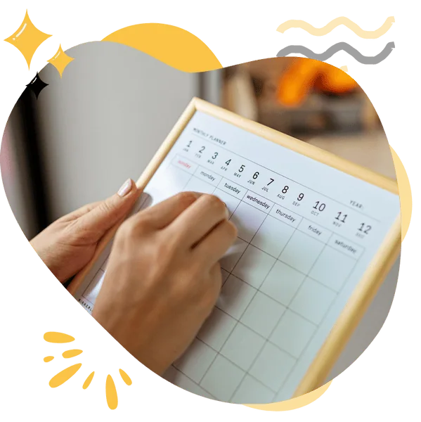 A person writing on a monthly planner with dates and days of the week visible, representing Hellamaid’s cleaning services for weekly, bi-weekly, and monthly schedules across Canada.