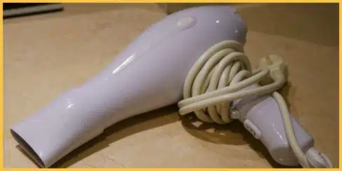 Hair dryer used to heat and remove gum from a couch.
