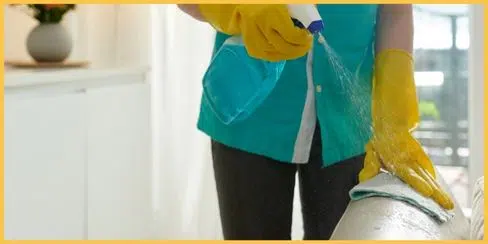 Hellamaid professional cleaner removing gum residue from a couch.