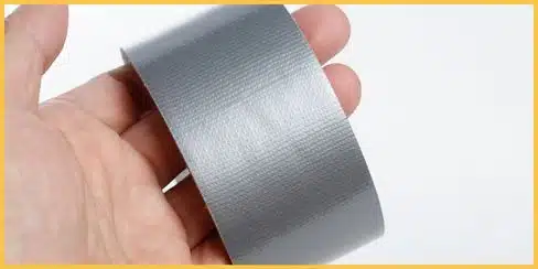 Duct tape used to remove chewing gum from a sofa.