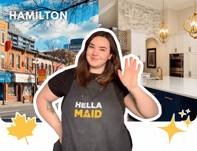 Hellamaid team member in Hamilton with a clean kitchen and city backdrop, ready to offer professional cleaning services