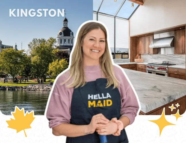 Hellamaid team member in Kingston with a scenic waterfront background, wearing a Hellamaid apron and showcasing professional cleaning skills