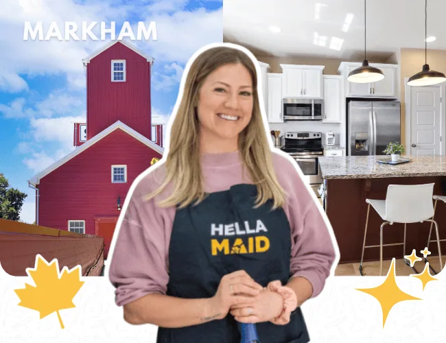 Hellamaid team member in Markham standing in front of a red barn, wearing a Hellamaid apron and ready to deliver professional cleaning services
