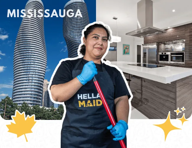 Hellamaid team member in Mississauga, holding a mop in front of a sleek kitchen and iconic city skyline
