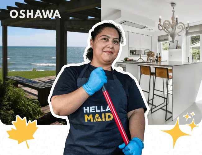 Hellamaid cleaner in Oshawa, holding a cleaning tool with a contemporary kitchen and lakefront view