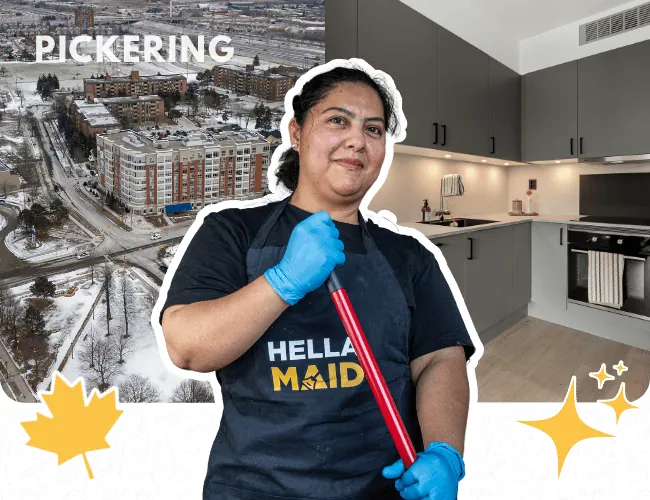 Hellamaid cleaner in Pickering, holding a mop in front of a modern kitchen and city skyline