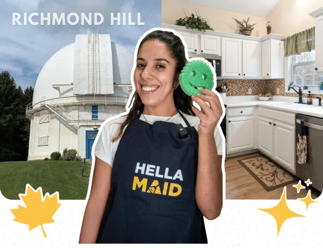 Hellamaid team member from Richmond Hill holding a cleaning sponge with a modern kitchen and observatory in the background