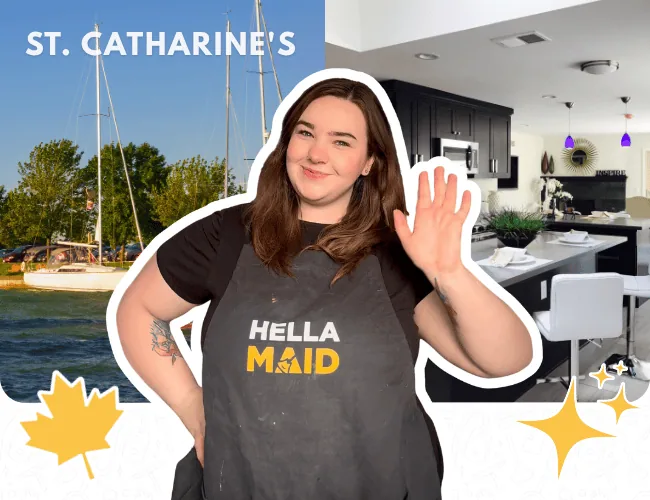Hellamaid cleaning team member in St. Catharines, Ontario, smiling with a wave, with a waterfront backdrop and a beautifully styled interior