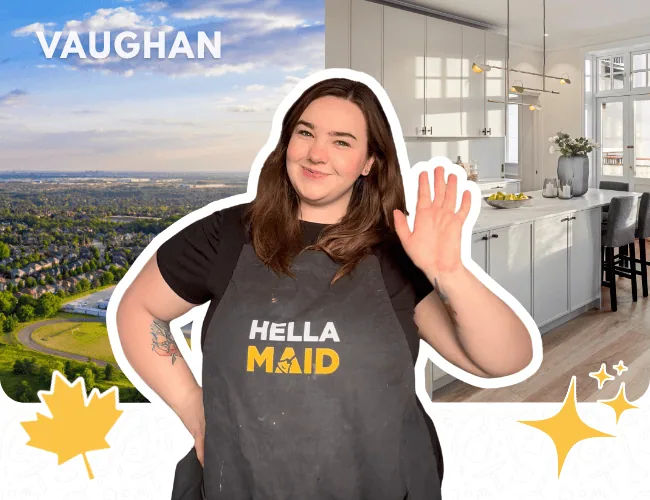 Hellamaid professional in Vaughan standing in front of a scenic city view and sleek kitchen