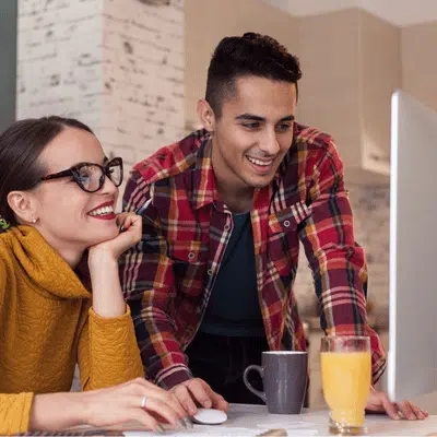 couple booking a cleaning service online with Hellamaid