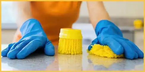 Professional cleaning service team of Hellamaid using brush and sponge in cleaning.