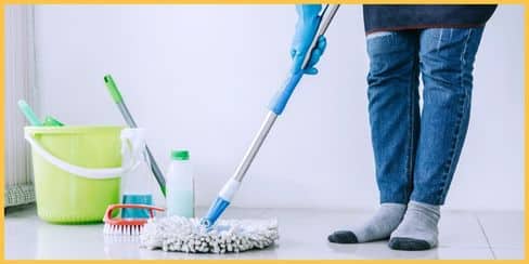 A professional cleaner in Canada mopping the floor. 