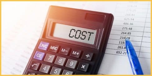 A calculator with "COST" on its screen. 