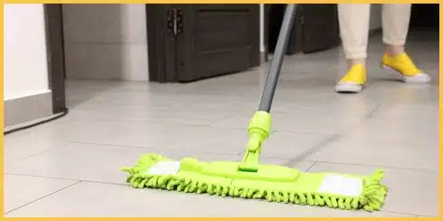 A professional cleaner mopping the floor.