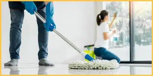 Professional cleaners in Vancouver tidying a house.
