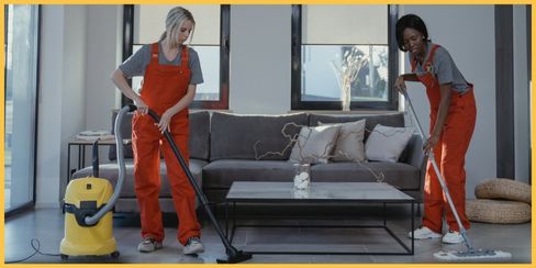 Professional cleaning service in Toronto tidying up a living room.