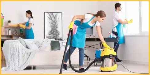 Cleaning team that's tidying a living area.