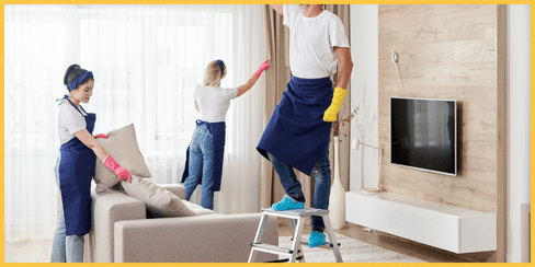 The cleaners of Hellamaid, a top-rated cleaning company in Canada, tidying a living room.