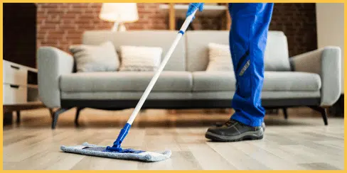 A cleaner mopping the floor.