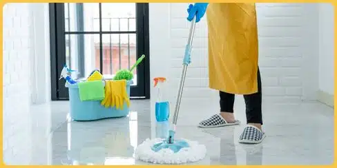 A cleaner mopping the floor.