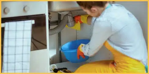 A professional cleaner tidying an under ni asawa.